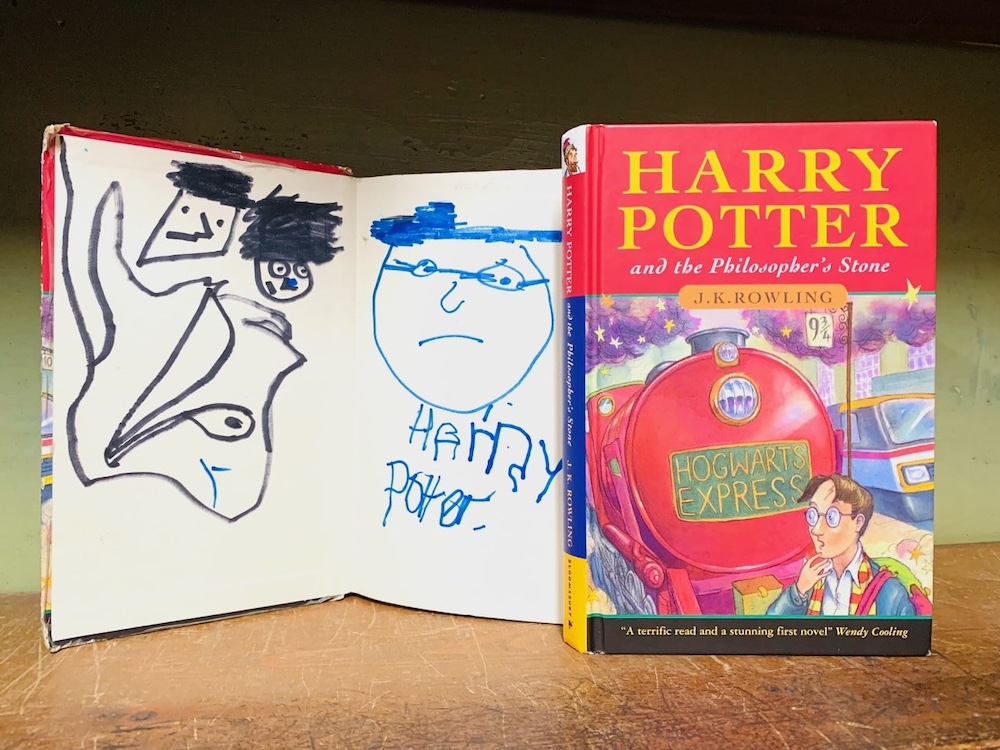 The-doodled-Potter-book-worth-2-3k-next-to-the-pristine-version-worth-40-60k-credit-Hansons