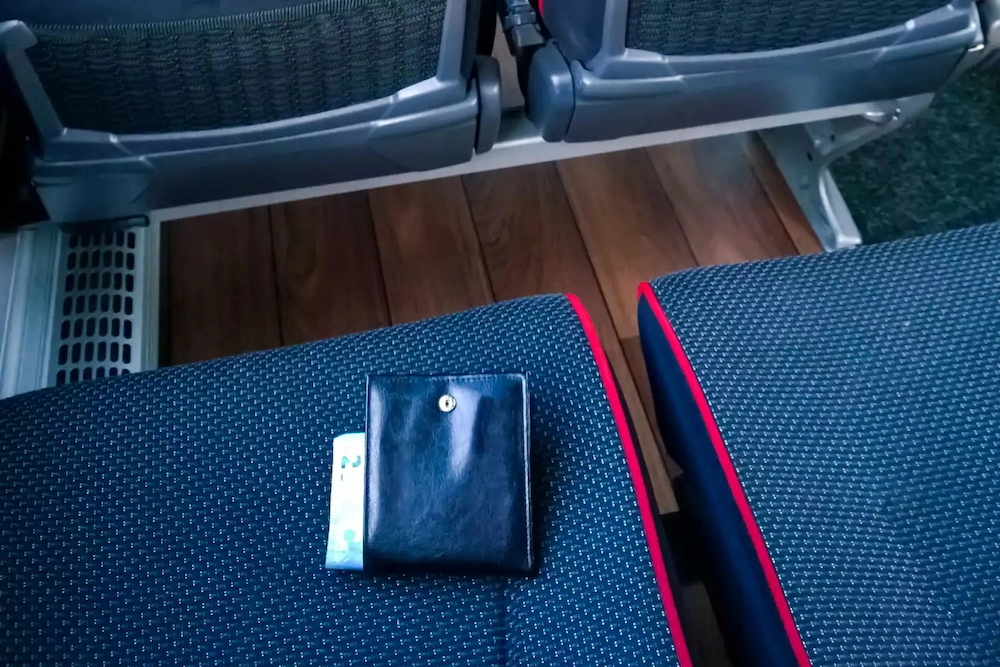 Wallet-Laying-In-The-Seat-Of-An-Aircraft copy